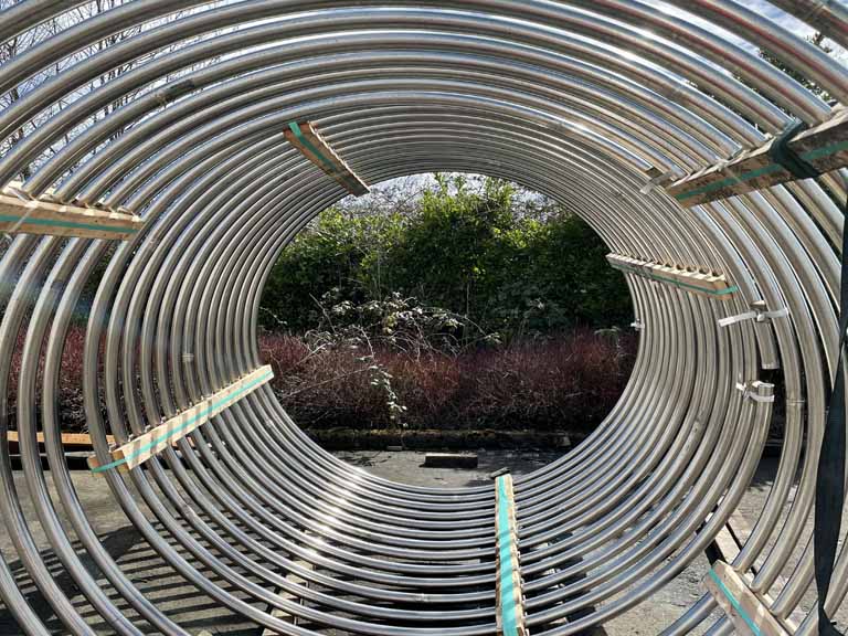 Coiled 39 lengths x 20 feet of 2” OD x .120” wall T304 s/s (180 grit)